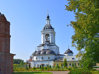Fototapeta na wymiar Gate St. Nicholas Church with two towers on the sides on the territory of The Avraam monastery was built in 1691 by the masters of Jonah Sysoevich. Russia, Rostov, August 2019