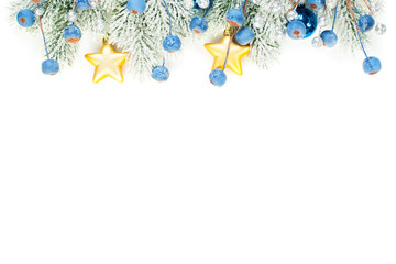Christmas composition border with blue frozen berries, stars, gold garland and Xmas tree branch...
