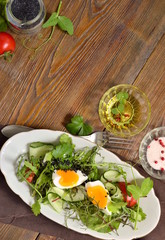 Cucumber, tomato, egg, fresh green salad with black sesame, vertical, top view, copy space
