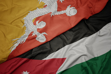 waving colorful flag of jordan and national flag of bhutan.