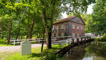 The old mill by Fiskars River in Fiskars Village, Raasepori, Finland. The mill was built of slag...