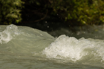 Closeup of the water in a small river in the alps