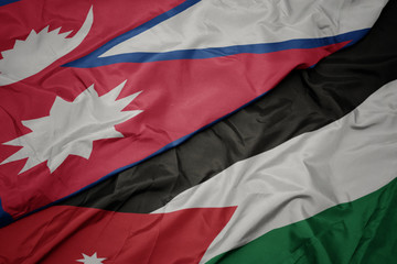 waving colorful flag of jordan and national flag of nepal.