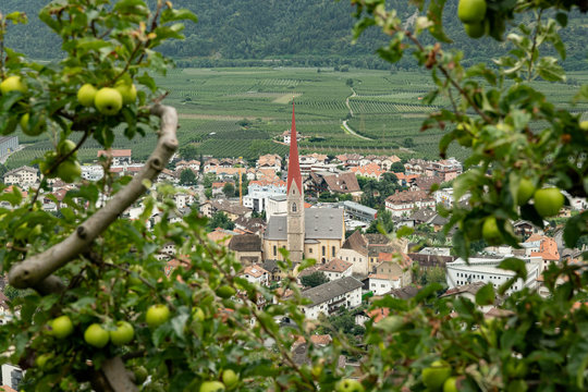 The city of Schlanders from above on a cloudy day in summer