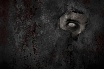 Scary zombie man eye peeking