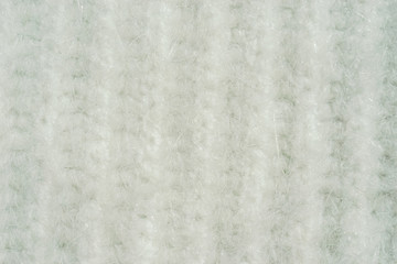 Background with knitted white texture.