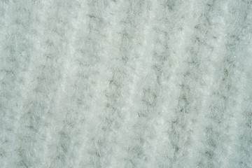 Background with knitted white texture.