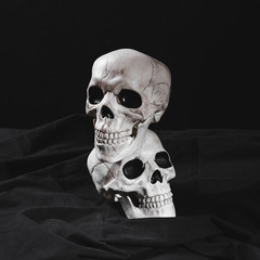 Spooky skullsÂ on black canvas