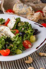 salad provence with blue cheese on wooden table