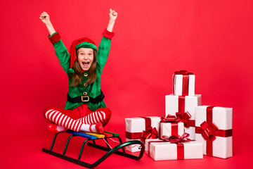 Portrait of her she nice attractive cheerful overjoyed pre-teen elf Santa Claus look sitting on...