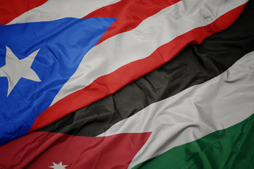waving colorful flag of jordan and national flag of puerto rico.