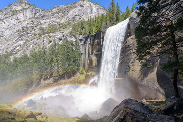 Wide angle view of Vernal Falls with doulble ranbows on beautiful day with blue sky, Yosemite National Park, California