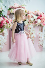 Obraz na płótnie Canvas happy little girl in a beautiful magnificent dress