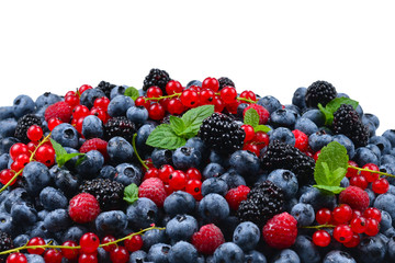 Blackberry, raspberry, blueberry,  red currant and mint background.