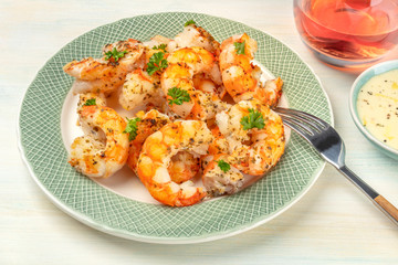 Shrimps with with a glass of rose wine and a dip