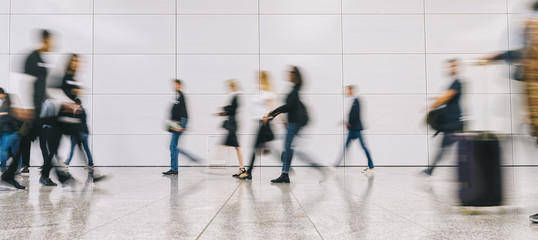 blurred business people at a trade fair