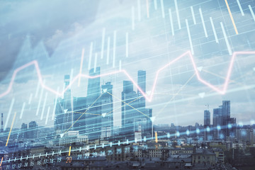 Double exposure of financial graph on downtown veiw background. Concept of stock market research...