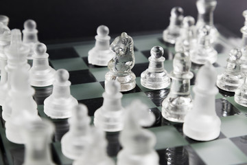 Transparent chess pieces on board
