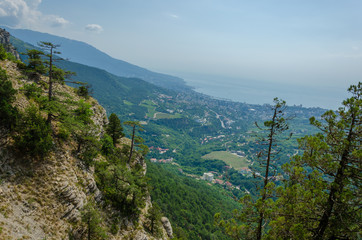 In summer, the mountains are covered with coniferous forest.