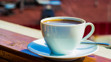 cup of coffee on wooden table