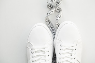 Stylish white fashion sneakers on white background.