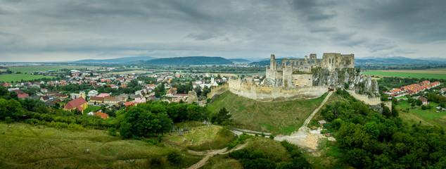 Aerial view of medieval Beckov castle with inner and outer courtyard, cannon tower,  castle gate, chapel in Slovakia 