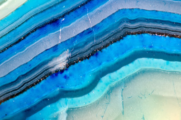 Blue background from crystal. Close-up. Abstract lines. For winter projects. Stone structure
