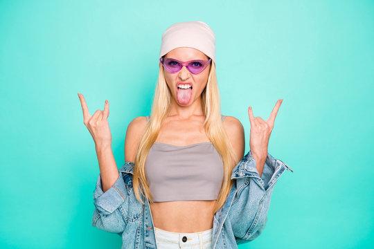 Close-up portrait of her she nice-looking attractive lovely cool crazy content straight-haired girl showing horn symbol isolated over bright vivid shine green turquoise background