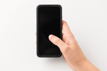 gadget and technology concept - close up of hand with black smartphone