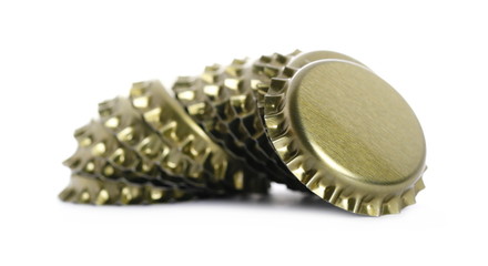 New golden bottle cap for beer isolated on white, side view, macro