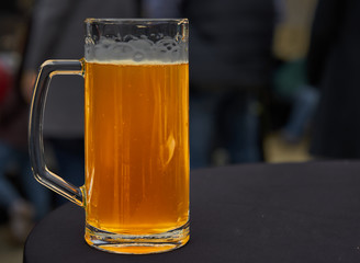 Glass with stale beer without foam