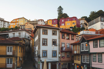 Fototapeta na wymiar View on old buildings in Porto, Portugal. Sunset in the city.