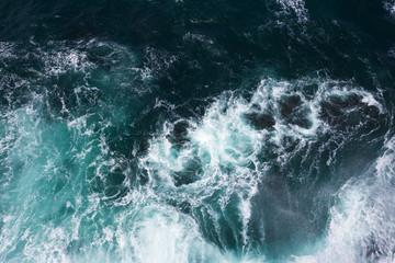 Aerial on ocean waves and foam.