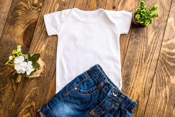 T-Shirt Mockup with jeans on a Wooden Background