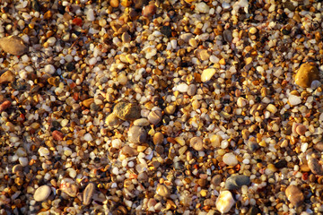 sea pebbles colored granite on the beach