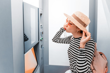 Asian girl having fun and making faces in the photo booth. The concept of small business in the...