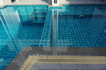 Swimming pool with stairs and colours tiles