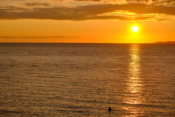 Sunset over Adriatic Sea with golden dramatic sky panorama.
