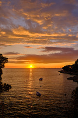 Fototapeta na wymiar Sunset over Adriatic Sea with golden dramatic sky panorama.