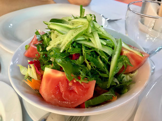Turkish Season Salad Mevsim Salatasi with Tomatoes and Cucumber Slices at Restaurant.
