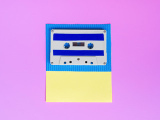 Fototapeta premium Vibrant cassette tape on bright wallpaper