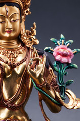 Gilded form of Green Tara Executed in the Tibetan tradition.
