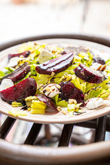 Homemade Healthy Salad with Beetroot, Goat Cheese, Pine Nuts and Balsamic Cream