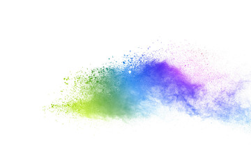 Freeze motion of colorful color powder exploding on white background.  Paint Holi.