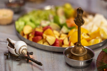 Puja Ritual Preparations. Background concept for durga puja preparations. Shankha, Brass Bell, A plate full of fruits, prasad for indian hindu festival rituals.