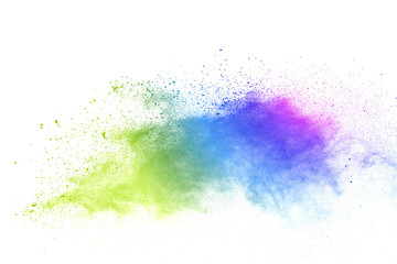 Freeze motion of colorful color powder exploding on white background.  Paint Holi.
