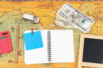 Fototapeta na wymiar Blank notebook with accessory on world map. travel business concept