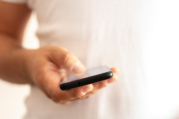 Holding smartphone. Online, communication.