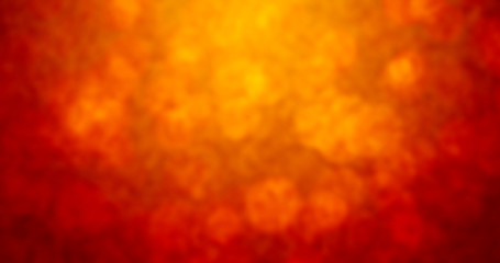 Abstract colorful background with grunge noise grain texture and vivid radial color gradient of red, orange, brown and yellow