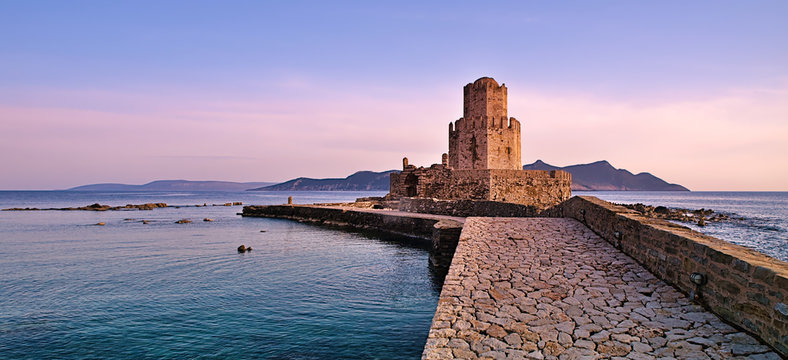 Impressive three-tiered watchtower, Venetian fort castle of Methoni, Greece at sunset time.